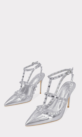 MELANIA ZAPATILLAS SLINGBACK PLATA CONFECCIONADAS EN CHAROL METALICO CON TACON DE 10 CM Y TERMINACION PUNTIAGUDA CON ESTOPEROLES EN STRAPS CRUZADOS 